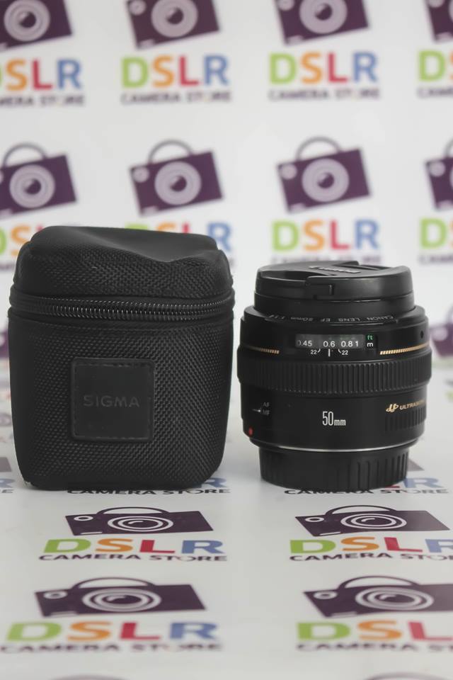 Un Lumix S Pro F1.4 50 mm avec son boîtier